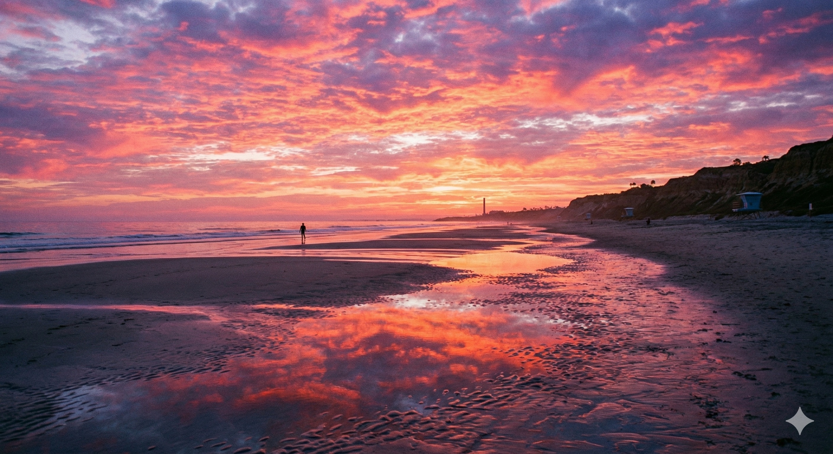 Sunrise over Carlsbad beach with exposed reef at extremely low tide